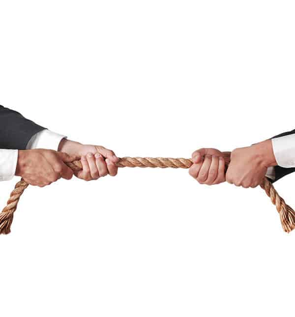 Real Estate And Business Litigation Law Firm - Hands pulling opposite ways on rope.