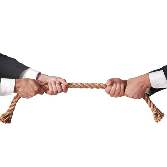Real Estate And Business Litigation Law Firm - Hands pulling opposite ways on rope.